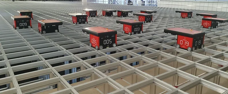 AutoStore robots on an automated warehouse grid